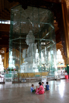 This Buddha is protected by plexiglass.