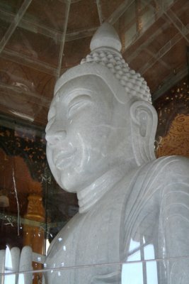 Closeup of the marble Buddha which is the largest stone Buddha in world.