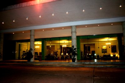 The faade of the hotel at night.
