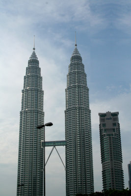 The towers were designed by architect Csar Pelli, were completed in 1998 and were the worlds tallest buildings at completion.