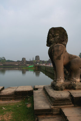 Closeup of one of the lion sculptures with 200 meter wide moat in the background.