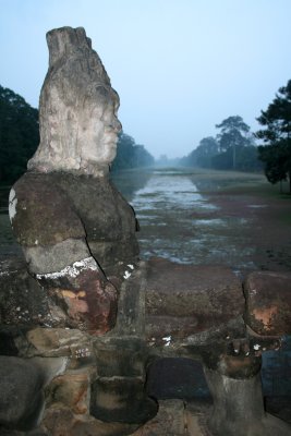 A similar demon statue as seen at dusk.