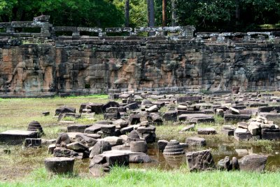Stone ruins in front of the Elephant Terrace, a part of the walled city of Angkor Thom.