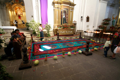 A beautiful Guatemalan carpet on display for the Lent season in front of the worshippers.