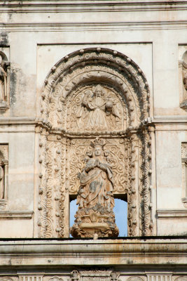 Close-up of religious carvings on the upper faade.