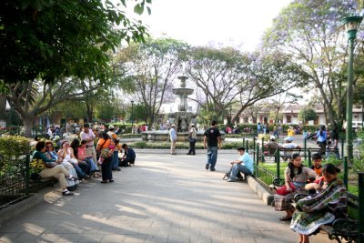 People enjoying the beautiful Parque Central in Antigua.