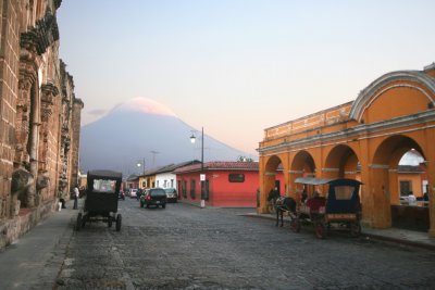 View of the arches where the horse and buggy and driver were.  Note the Volcn de Agua (mountain) in the background.