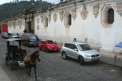 Horse and buggy passing on 5a Ca Oriente in front of the Colonial Museum.
