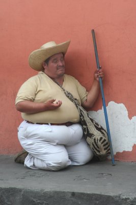 A blind and obese beggar that I saw while walking.