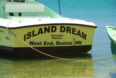 An appropriate name for a boat in the serene beauty of Roatn.