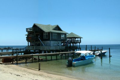 This is one of many houses that are built on stilts along the water.