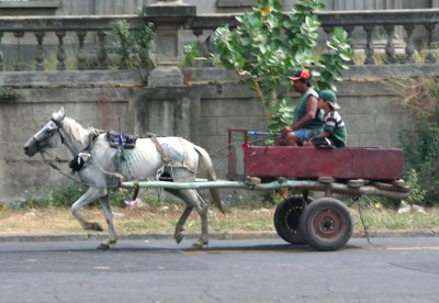 Riding in a horse and buggy in front of the Santo Domingo Cathedral (old cathedral) in Managua.