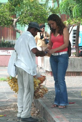 Next to the Park of Heros, this woman was buying fruit from a street vendor.