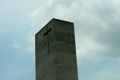 The cathedral's tower displays a cross.