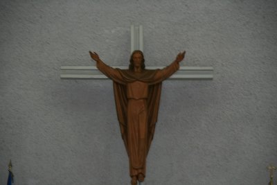 A crucifix hangs over the altar.