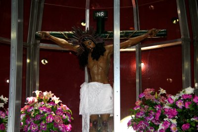 Close-up of glass enclosed crucifix in the chapel.