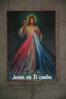 Close-up of the painting of Christ with the sign Jesus, en Ti confio (in you I trust).
