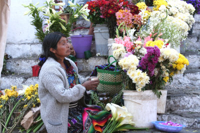 Close-up of a flower merchant on the steps of Santo Tomás.