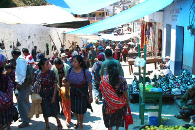 There were many people strolling around the market that day.