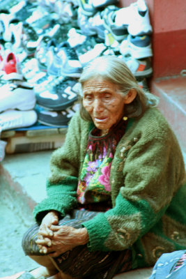 An elderly Guatemalan woman in Chichicastenango taking in the market around her.