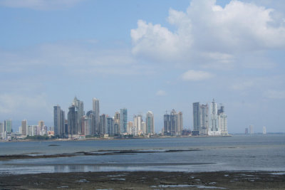Panama City skyline as seen from Las Bvedas.  The Amador Causeway and Bridge of the Americas can also be seen from the walkway.
