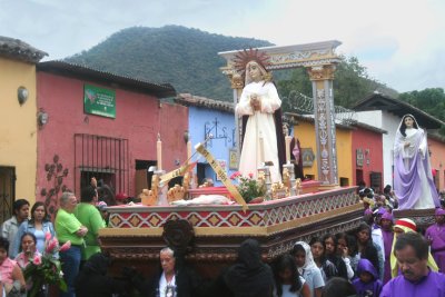 Float with women carrying the Virgin Mary.