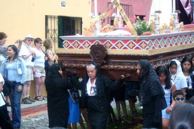 Note that these women who were carrying the float were shrouded in black.