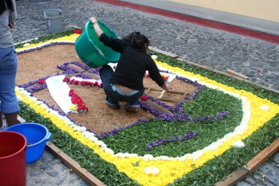 This woman was doing intricate work in the preparation of this carpet.