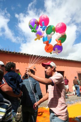 Balloon vendor with helium balloons.