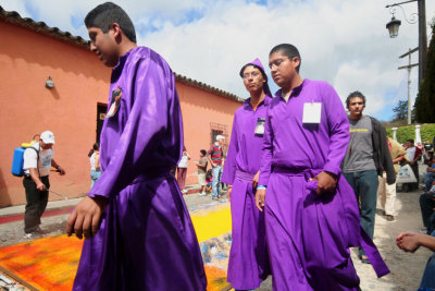 Purple is the color of the robes worn by the carriers up to Good Friday, then the robes are black to signify mourning.
