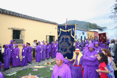 Processions generally begin with incense carriers and the brotherhood's banner, such as this one.