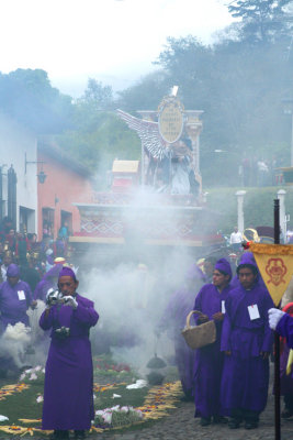 The lead float was approaching. Note the smoke from burning incense.