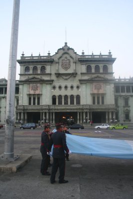 Since it was late in the day, these soldiers were taking down the Guatemalan flag in front of the National Palace.