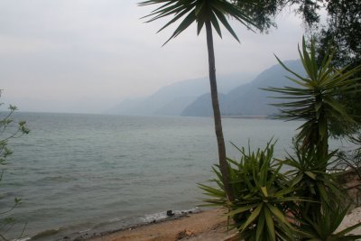 The lake is shaped by deep escarpments (long steep slopes or cliffs), surrounding it and by 3 volcanoes on the south.