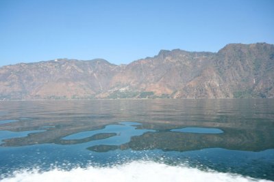 The boat passed by this rocky volcanic shoreline.