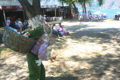 Shortly thereafter, I saw this chicken man carrying chickens on his back and in his arms.