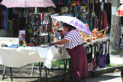 This Indian vendor was protecting herself from the sun with her umbrella.