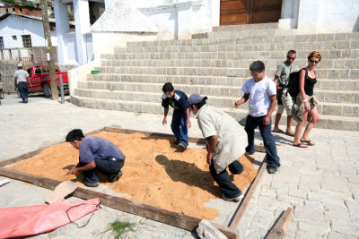 These Guatemalan workmen were laying out sand in front of the cathedral.