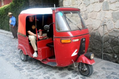 I couldn't resist - that's me in the 3-wheeled taxi!