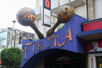 An interesting entrance sign to a nightclub on Avenida Central with colorful maracas on display.