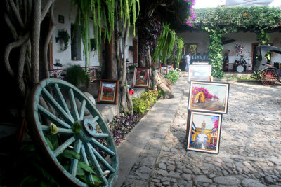 Wagon wheel with artwork on display in the main courtyard.