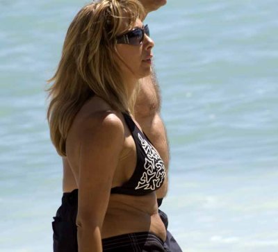 Lady waking the beach