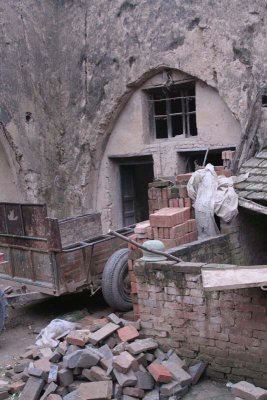 For over 100 years, generations of this family have lived in caves surrounding a 20 foot deep pit