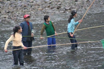 They would approach passing boats and beg for something to be thrown to them,