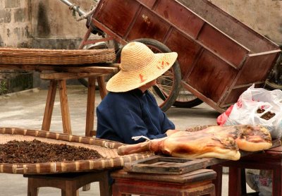 Seller of pork sides and herbs