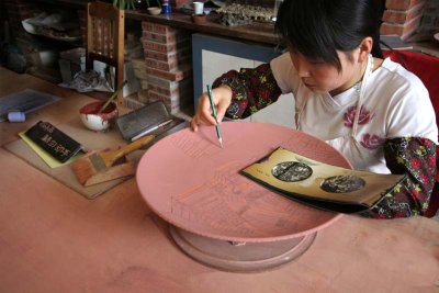 scribing an image onto a plate