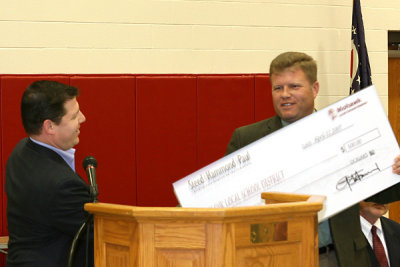 Alan Maletz presenting a $500 Student  Scholarship to Board President Duane Coldiron