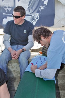 Greg Long and Randy Cone signing t-shirts