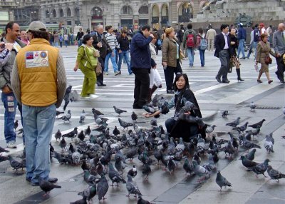 People and pigeons in Piazza del Duomo, Milan's central square