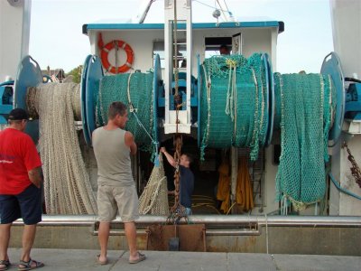 Untangling the nets after the day's fishing